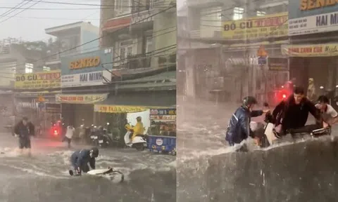 'Sốt' clip 3 thanh niên lao ra cứu chiếc xe máy bị mưa lớn cuốn trôi ở TP.HCM